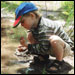 Photo: A boy playing outside