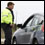 Photo: An officer talking to a driver in a car