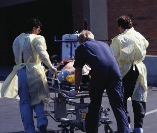 emergency response team wearing protective gloves and gowns