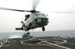 An SH-60B Seahawk helicopter takes off from the flight deck of the guided missile cruiser USS Thomas S. Gates during UNITAS 45-04 Pacific Phase, July 19, 2004.