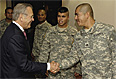 Secretary of Defense Donald H. Rumsfeld speaks with troops preparing to return to Iraq and Afghanistan