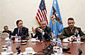 Secretary of Defense Donald H. Rumsfeld (center) responds to a reporter's question during a press conference at NATO headquarters in Brussels, Belgium, Dec. 2, 2003. U.S. Ambassador to NATO R. Nicholas Burns (left) and Vice Chairman of the Joint Chiefs of Staff Gen. Peter Pace, U.S. Marine Corps, joined Rumsfeld as he updated the press on the progress of the meetings. Rumsfeld is at NATO headquarters for a two-day meeting of allied defense ministers to discuss expanding NATO's mission.