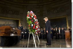 President George W. Bush and Laura Bush present the Executive Branch Wreath during a wreath-laying ceremony in honor of Rosa Parks, in the Rotunda of the U.S. Capitol in Washington, D.C., Sunday Oct. 30, 2005. White House photo by Shealah Craighead