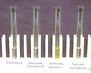 Four tests tubes with colorimetric test, only the one with genuine artesunate is colored yellow.