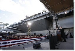 President George W. Bush gestures as he addresses his remarks in honor of Veteran's Day Tuesday, Nov. 11, 2008, at the rededication ceremony of the Intrepid Sea, Air and Space Museum in New York.  White House photo by Eric Draper