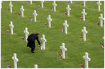 Mrs. Laura Bush lays flowers at the Netherlands American Cemetery Sunday, May 8, 2005, in Margraten.