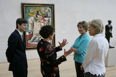 Mrs. Laura Bush stops in front of Pablo Picasso's painting 'Nude Man and Woman' as she is given a tour of the Nasher Sculpture Center by Acting Chief Curator Jed Morse, left, Trustee Nancy Nasher, gesturing, and Debbie Francis, right, Friday, Sept. 19, 2008 , in Dallas. White House photo by Chris Greenberg