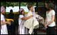 Mrs. Laura Bush and daughter Ms. Barbara Bush examine local wares after a dance ceremony and viewing traditional Karen weaving at the Mae La Refugee Camp at Mae Sot, Thailand, on Aug. 7, 2008. Mrs. Bush's visit to one of the largest refugee camps on the border was at the top of a mountain on the border with Burma. In her comments, Mrs. Bush noted the generosity of the Thai government and the people of Thailand in allowing the nine camps to exist there. White House photo by Shealah Craighead