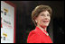 Mrs. Laura Bush accepts the Woman's Day Magazine Red Dress Award in New York, NY for her leadership in raising awareness of women's heart disease, February 1, 2007, as Jane Chestnutt, Editor in Chief of Woman's Day, looks on.