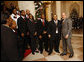 President George W. Bush welcomes members of the musical group Sweet Heaven Kings to the White House, Monday, Dec. 8, 2008, where the musical group performed at the Children's Holiday Reception and Performance. White House photo Eric Draper White House photo by Eric Draper