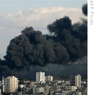 Smoke from Israeli strikes billows from Gaza Strip, as seen from Gaza City, 09 Jan 2009