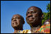 Guests in traditional Ghanaian dress stand for the playing of the national anthems Monday, Sept. 15, 2008, during the South Lawn Arrival Ceremony for President John Agyekum Kufuor of Ghana at the White House.