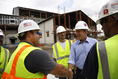 President George W. Bush meets with construction workers on his tour Wednesday, Aug. 20, 2008 of the historic Jackson Barracks of New Orleans, headquarters of the Louisiana National Guard. The barracks were seriously damaged in 2005 by Hurricane Katrina. White House photo by Eric Draper