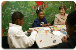 Mrs. Laura Bush sculpts clay with participants of the Communications Through Art program at the Knox County Public Defenders Community Law Office in Knoxville, Tennessee, Wednesday, October 11, 2006, as part of the President's Helping America's Youth program. Communications Through Art program uses the arts to help young people express themselves and to deal with important issues of the day. White House photo by Shealah Craighead