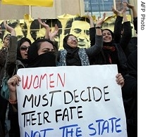 A female Iranian student holds a banner against the policies of the Iranian government at a demonstration at Tehran University, 09 Dec 2007