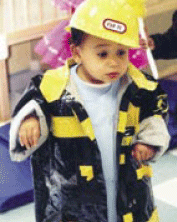 photo of child in a firefighter costume