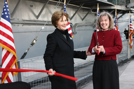 Mrs. Laura Bush and Sally Hoover Casale, daughter of the late U.S. Navy aviator Captain William 'Bill' H. Hoover, complete the ribbon cutting Tuesday, Nov. 11, 2008, to release a bottle for the re-christening of the USS Intrepid, during the rededication ceremony for the Intrepid Sea, Air and Space Museum in New York. White House photo by Chris Greenberg