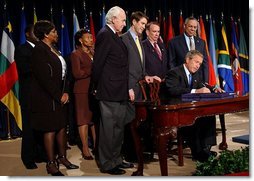 President George W. Bush signs H.R. 1298, the United States Leadership Against HIV/AIDS, Tuberculosis, and Malaria Act of 2003, at the State Department in Washington, D.C., Tuesday, May 27, 2003. The legislation commits $15 billion to fight AIDS abroad.  White House photo by Tina Hager
