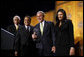 President George W. Bush is presented with an award by Ambassador Andy Young, Chairman of the Board, The Leon H. Sullivan Foundation, for his dedication and committed service to Africa, after speaking to The Leon H. Sullivan Foundation Tuesday, Feb. 26, 2008, in Washington, D.C. Joining them on stage is Ambassador Howard Jeter, president and CEO of The Leon H. Sullivan Foundation, far left, and Hope Masters, daughter of the late Rev. Leon H. Sullivan. White House photo by Eric Draper