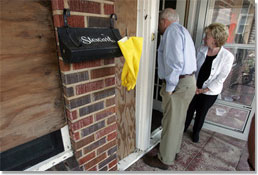 Vice President Dick Cheney and Mrs. Cheney survey damages in one Gulf Shore, Mississippi home Thursday, September 8, 2005, during a walking tour of a neighborhood that was damaged recently by Hurricane Katrina. White House photo by David Bohrer