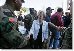 Mrs. Cheney shakes hands with police and military EMS personnel during a recent tour to the flood ravaged areas of New Orleans, Louisiana Thursday, September 8, 2005, to survey damage and relief efforts in the wake of Hurricane Katrina. White House photo by David Bohrer