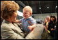 Mrs. Laura Bush receives a smile from a young boy as she greets the audience Monday, Aug. 4, 2008, after remarks by the President at Eielson Air Force Base, Alaska, their first stop en route to Asia. White House photo by Shealah Craighead