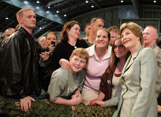 Mrs. Laura Bush joins members of the audience for photos Monday, Aug. 4, 2008, after remarks by President George W. Bush at Eielson Air Force Base, Alaska. White House photo by Shealah Craighead