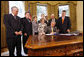 President George W. Bush signs H.J. Res. 93, the Renewal of Import Restrictions on Burma and H.R. 3890, the Tom Lantos Block Burmese JADE Act of 2008, Tuesday, July 29, 2008 in the Oval Office of the White House. President Bush was joined during the signings by, from left, Rep. Don Manzullo, R-Ill.; Rep. Chris Smith, R-N.J.; Mrs. Laura Bush, Annette Lantos, widow of Rep. Tom Lantos; Lantos grandson, Shiloh Tillemann; Rep.Rush Holt, D-N.J.; Rep. Joe Pitts, R-Pa.; and Rep. Peter King, R-N.Y. White House photo by Eric Draper