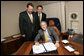 President George W. Bush is joined by Rep. Steven LaTourette, R-OH, left, and Rep. Patrick Tiberi, R-OH, at the signing of S.2766, The Clean Boating Act of 2008, Tuesday, July 29, 2008, aboard Air Force One on the flight from Euclid, Ohio to Washington, D.C. White House photo by Chris Greenberg