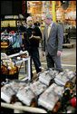 President George W. Bush speaks with a worker during his tour of the Lincoln Electric Company in Euclid, Ohio, on Tuesday, July 29, 2008, where President Bush also addressed remarks on energy and economic issues. White House photo by Chris Greenberg