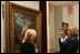 Mrs. Laura Bush and Mrs. Kateryna Yushchenko listen to Ms. Natalia Klimenko, General Director of the Taras Shevchenko National Museum, as she describes a painting by the great Ukrainian poet and artist during their tour Tuesday, April 1, 2008, in Kyiv.