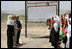 Mrs. Laura Bush is greeted by future students of the Ayenda Learning Center during her visit to the school's construction site Sunday, June 8, 2008, in Bamiyan, Afghanistan. Joining Mrs. Bush is Governor of Bamiran Province Habiba Sarabi, left, and Ihsan Ullah Bayat, who directed a tour of the site.