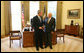 President George W. Bush stands with Truett Cathy, Founder, President and CEO of Chick-fil-A and Founder of the WinShape Foundation, after he presented Mr. Cathy with the Lifetime President's Volunteer Service Award at the White House. White House photo by Joyce N. Boghosian