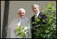 President George W. Bush and Pope Benedict XVI pause along the White House Colonnade to look at the Rose Garden on their way for a meeting in the Oval Office Wednesday, April 16, 2008, following the Pope's welcoming ceremony on the South Lawn of the White House. White House photo by Chris Greenberg