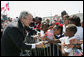 President George W. Bush shakes hands with students from New Orleans area schools upon his arrival to Louis Armstrong New Orleans International Airport Monday, April 21, 2008, where President Bush will attend the 2008 North American Leaders’ Summit. White House photo by Joyce N. Boghosian