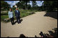 President George W. Bush and Germany's Chancellor Angela Merkel pause for photos during a walk in the garden Wednesday, June 11, 2008, during the President's visit to Schloss Meseberg, north of Berlin. The President met with Chancellor Merkel for a day of meetings before continuing his European visit with a stop in Rome. White House photo by Eric Draper