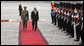 President George W. Bush is escorted by Italian General Rolando Mosca Moschini as he reviews the Guardia D'Onore Thursday, June 12, 2008, on his arrival to the Quirinale Palace in Rome. White House photo by Eric Draper