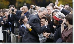President George W. Bush embraces an employee of the Executive Office of the President Thursday, Nov. 6, 2008, after delivering remarks to his staff on the upcoming transition. Said the President, ".Over the next 75 days, all of us must ensure that the next President and his team can hit the ground running.'  White House photo by Eric Draper