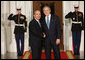 President George W. Bush greets Mexico's President Felipe Calderon Friday, Nov. 14, 2008, upon his arrival for dinner with Summit on Financial Markets and World Economy Leaders at the White House. White House photo by Chris Greenberg