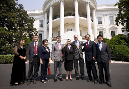 President George W. Bush poses for a photo at the South Portico entrance to the White House Tuesday, July 28, 2008, with Chinese Human Rights Activists, from left, Ciping Huang, Wei Jingsheng, Sasha Gong, Alim Seytoff, interpreter; Rebiya Kadeer, Harry Wu and Bob Fu, following their meeting at the White House. White House photo by Eric Draper