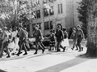 U.S. Troops escort African American students from Central High School, Little Rock, Arkansas