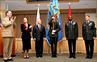 Left to right, Chairman of the Joint Chiefs of Staff Navy Adm. Mike Mullen; Henrietta H. Fore, administrator of U.S. Agency for International Developement and director of U.S. Foriegn Assistance; Defense Secretary Robert M. Gates; flag bearer; U.S. Africa Command Commander Gen. William E. Ward; and U.S. Africa Command Sgt. Maj. Mark S. Ripka stand together after the unfolding of the flag during the U.S. Africa Command Unified Command Activation ceremony in the Pentagon, Oct. 1, 2008. DoD photo by U.S. Petty Officer 2nd Class Molly A. Burgess