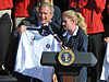 President Bush and first lady Laura display official Team USA Olympic jackets after being proclaimed honorary members of the team by 2008 U.S. Olympic and Paralympic athletes Oct. 7 on the south lawn of the White House. Five-time Paralympic goalball player Jennifer Armbruster (center) made the presentation. - Photo by Tim Hipps, FMWRC Public Affairs