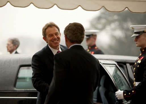President George W. Bush welcomes British Prime Minister Tony Blair upon his arrival to the White House Friday, Jan. 31, 2003. White House photo by Paul Morse