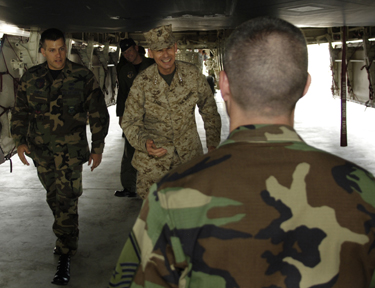 Chairman of the Joint Chiefs of Staff, Gen. Peter Pace, greets a B-2 bomber crew chief with his signature coin during a tour of Andersen Air Base, Guam, June 2, 2006. On his way to the annual Shangri-La Dialogue in Singapore, Gen. Pace, stopped in Guam to meet with deployed American forces and to receive a tour of the facilities. Photo by U.S. Air Force Staff Sgt. D. Myles Cullen