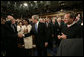 President George W. Bush shakes the hand of Secretary of Treasury Henry Paulson as he arrives on the House floor at the U.S. Capitol Monday, Jan. 28, 2008, to deliver his 2008 State of the Union address. Looking on are Secretary of State Condoleezza Rice and U.S. Supreme Court Chief Justice John Roberts. White House photo by Eric Draper