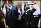 President George W. Bush greets school children during his visit Tuesday, Jan. 15, 2008, to Al Murabba Palace in Riyadh. The President is spending his last day in Saudi Arabia before continuing on to Egypt en route home to Washington, D.C. White House photo by Eric Draper