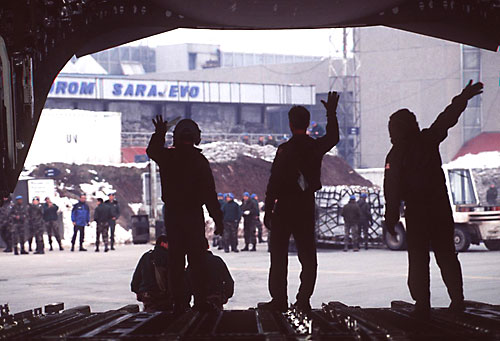 A U.S. Army soldier of the 502nd Engineering Company directs traffic across the pontoon bridge that links Croatia to Bosnia-Herzegovina. (U.S. Army Photograph by Specialist Alejandro Cabello)