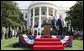 President Bush stands with India's Prime Minister Dr. Manmohan Singh, Monday, July 18, 2005 during the playing of the national anthems on the South Lawn of the White House. White House photo by Eric Draper