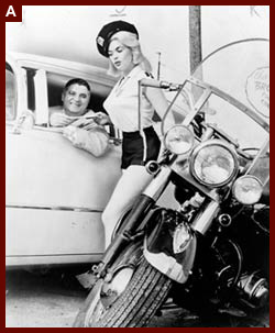Jayne Mansfield, posed as motorcycle cop "Miss Traffic Stopper," ticketing male driver], 1962